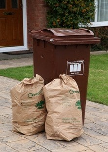 The brown wheeled bin and sacks for green waste which residents now have to pay to use